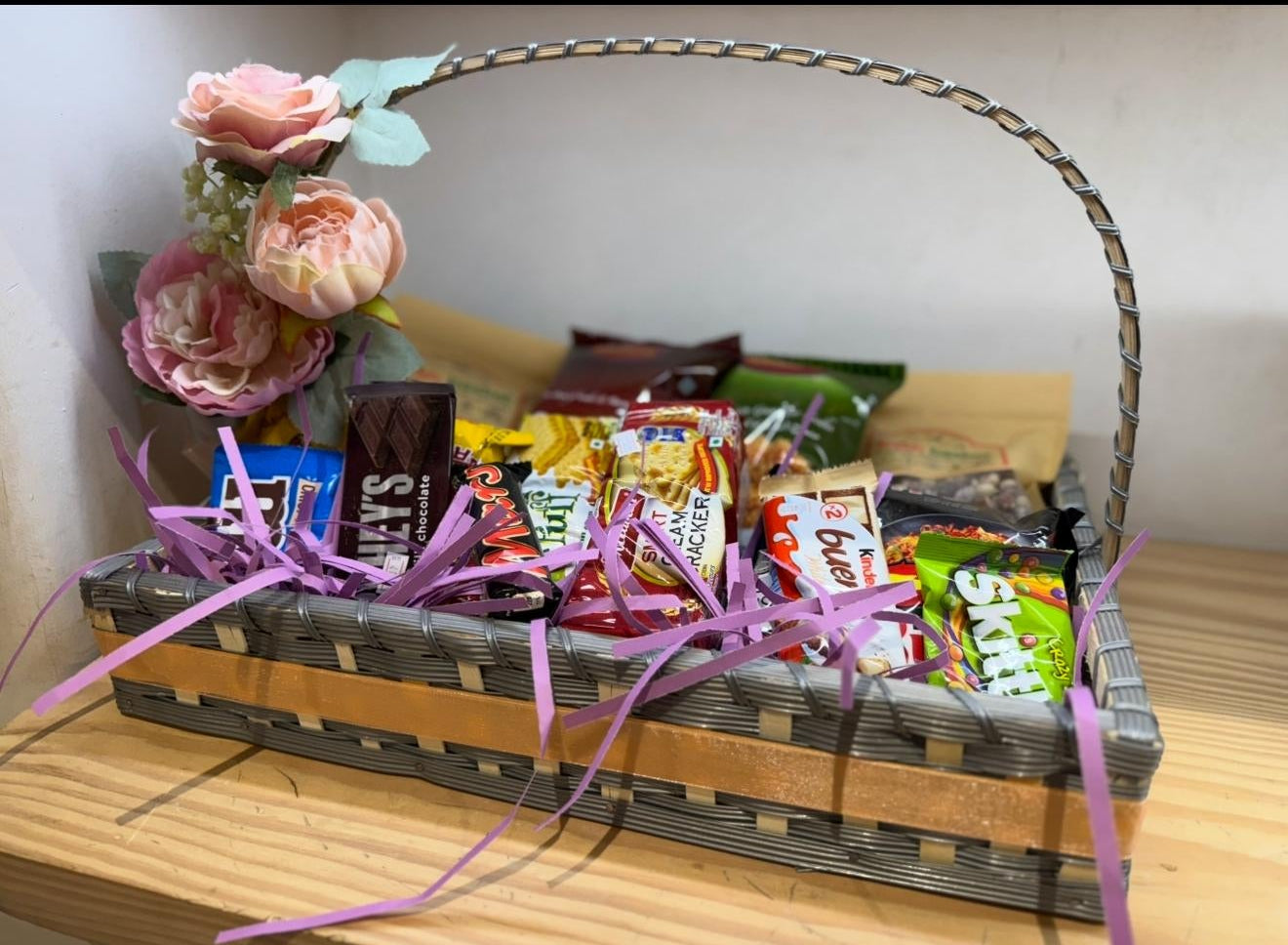 Elegant White Wicker Snack Collection with Pink Orchids
